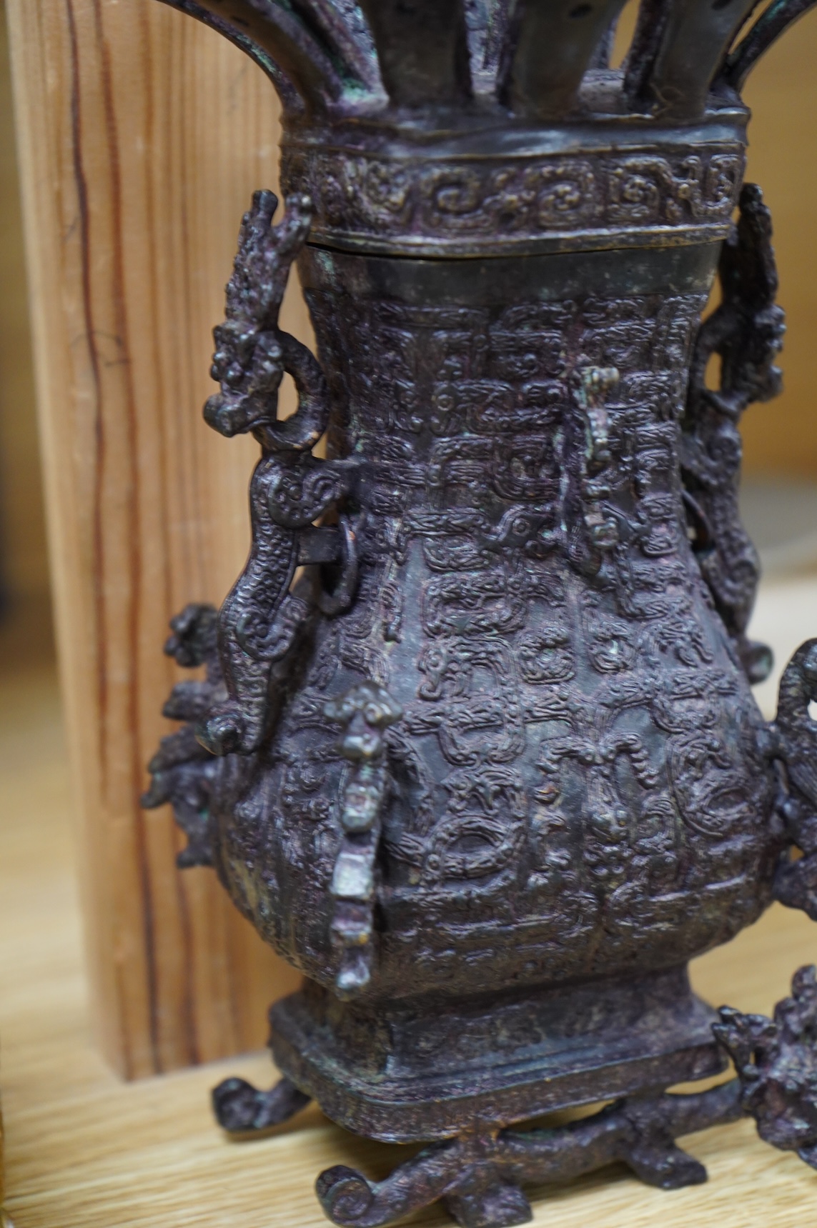 A Chinese Shang style bronze vessel and cover, 23cm